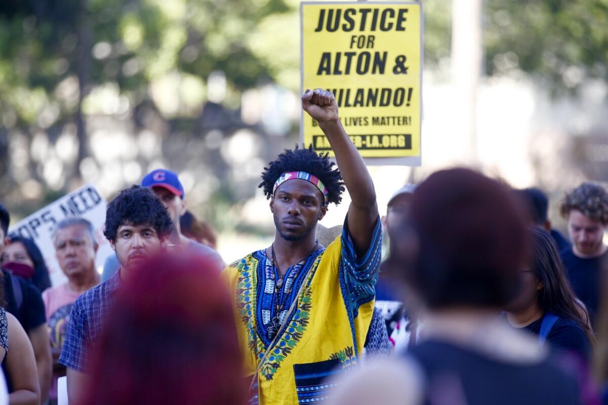 Colton Jones protests outside LAPD headquarters in response to the deaths of Alton Sterling and Philando Castille.