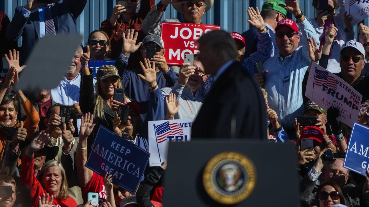 President Trump acknowledges supporters at a rally on Saturday in Elko, Nev.