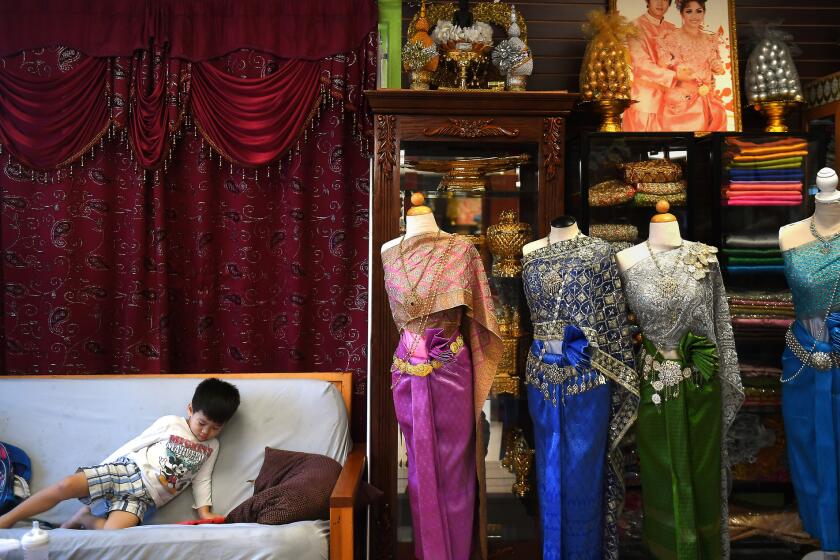 LONG BEACH, CA-OCTOBER 19, 2017: Skyler Khy, 3, left, hangs out at his mother's salon in Cambodia Town in Long Beach on Thursday, October 19, 2017. (Christina House / Los Angeles Times)