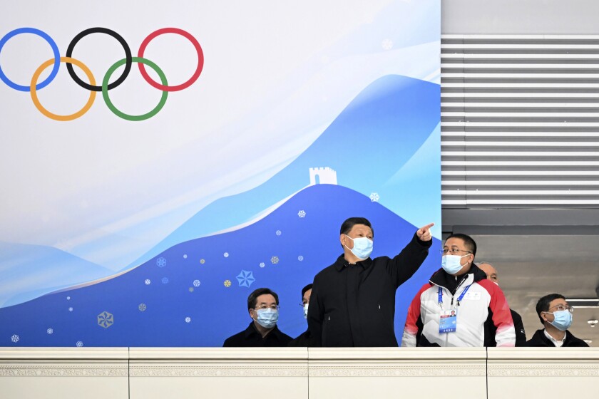 In this photo released by China's Xinhua News Agency, Chinese President Xi Jinping tours the National Speed Skating Oval, a competition venue for the 2022 Winter Olympics, in Beijing, Tuesday, Jan. 4, 2022. Competition for the Winter Olympics is scheduled to begin on Feb. 4. (Shen Hong/Xinhua via AP)