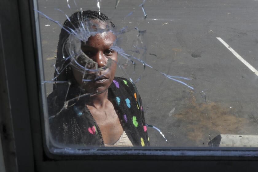 ROSAMOND, CA - JUNE 18: A bullet went through the kitchen window of Joyce Chaney, 40, ground floor apartment in a complex where Terron Boone was fatally shot by deputies Wednesday afternoon. Rosamond Garden Apartments on Thursday, June 18, 2020 in Rosamond, CA. (Irfan Khan / Los Angeles Times)