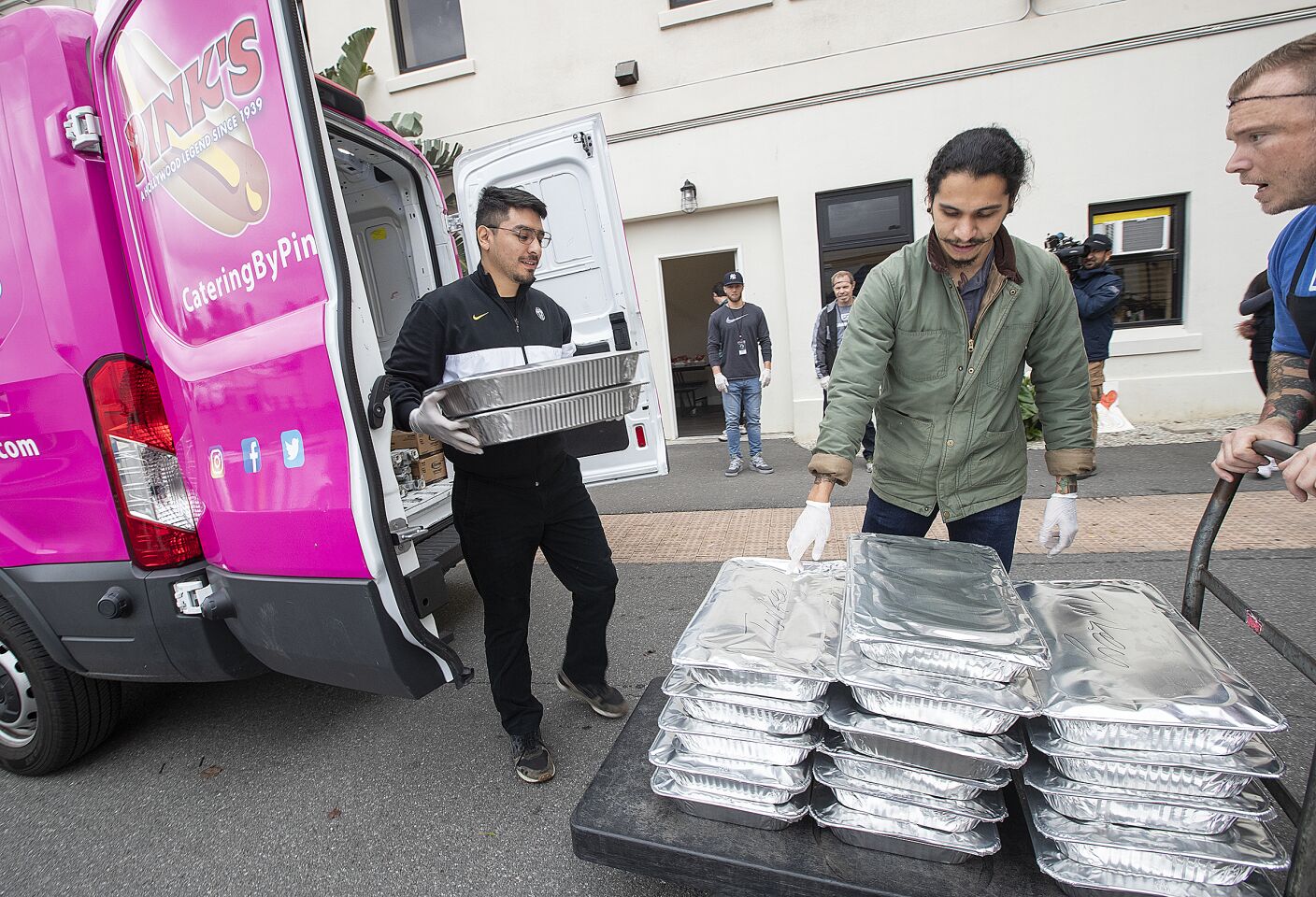 Pink's Hot Dogs workers deliver donated food to the Dream Center in L.A.