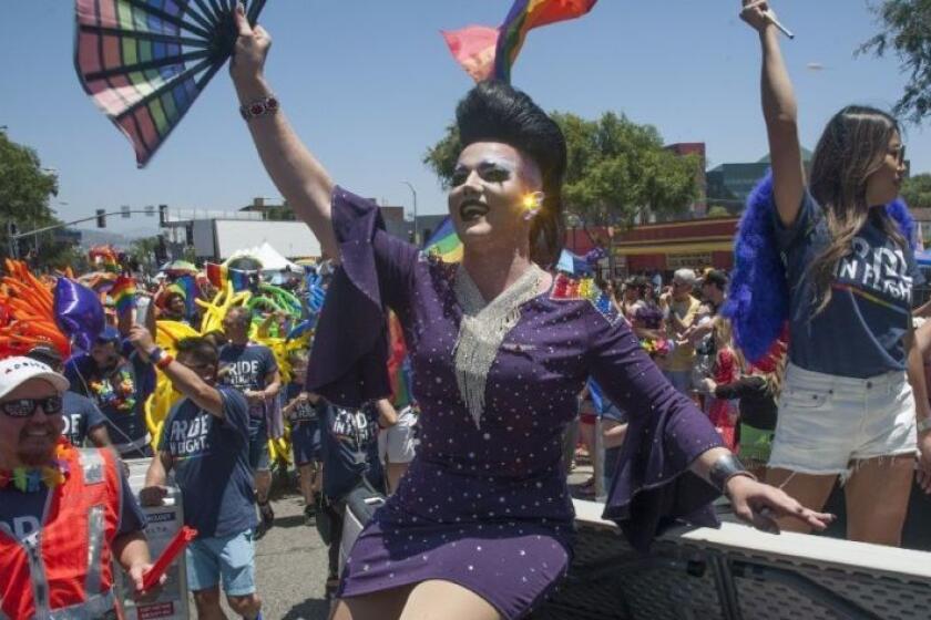 Revelers join the festivities for the 49th annual L.A. Pride parade in West Hollywood on Sunday.