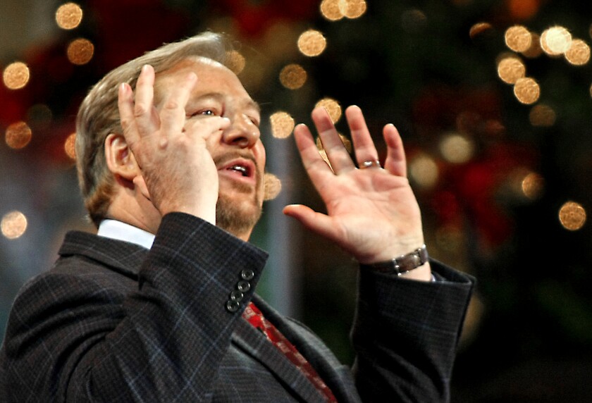 The Rev. Rick Warren gesturing during a worship service 