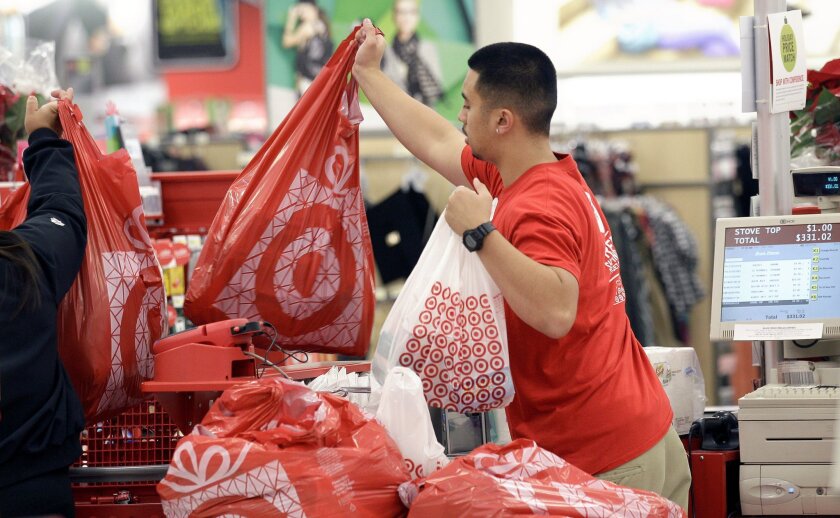 Workers whose jobs can be done at least partly while sitting should not be forced to stand, the California Supreme Court said Monday. Above, a worker at a Target store.