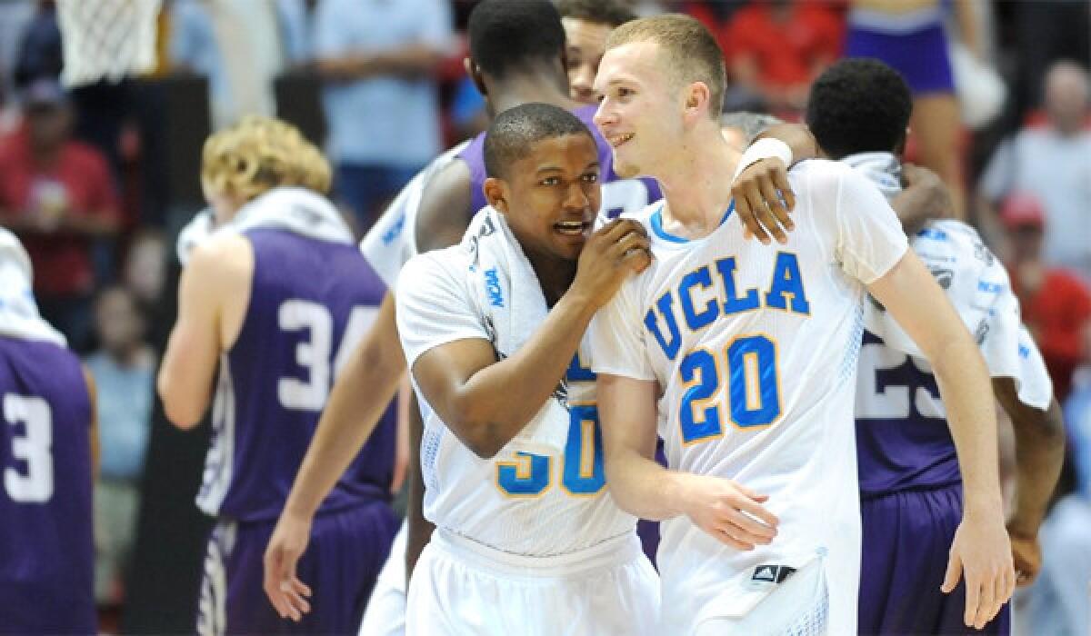 UCLA's Aubrey Williams and Bryce Alford celebrate after the Bruins' 77-60 win Sunday over Stephen F. Austin.