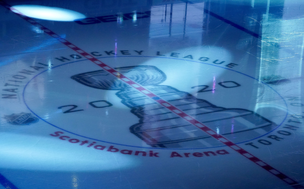 A detailed view of center ice with a Stanley Cup logo.