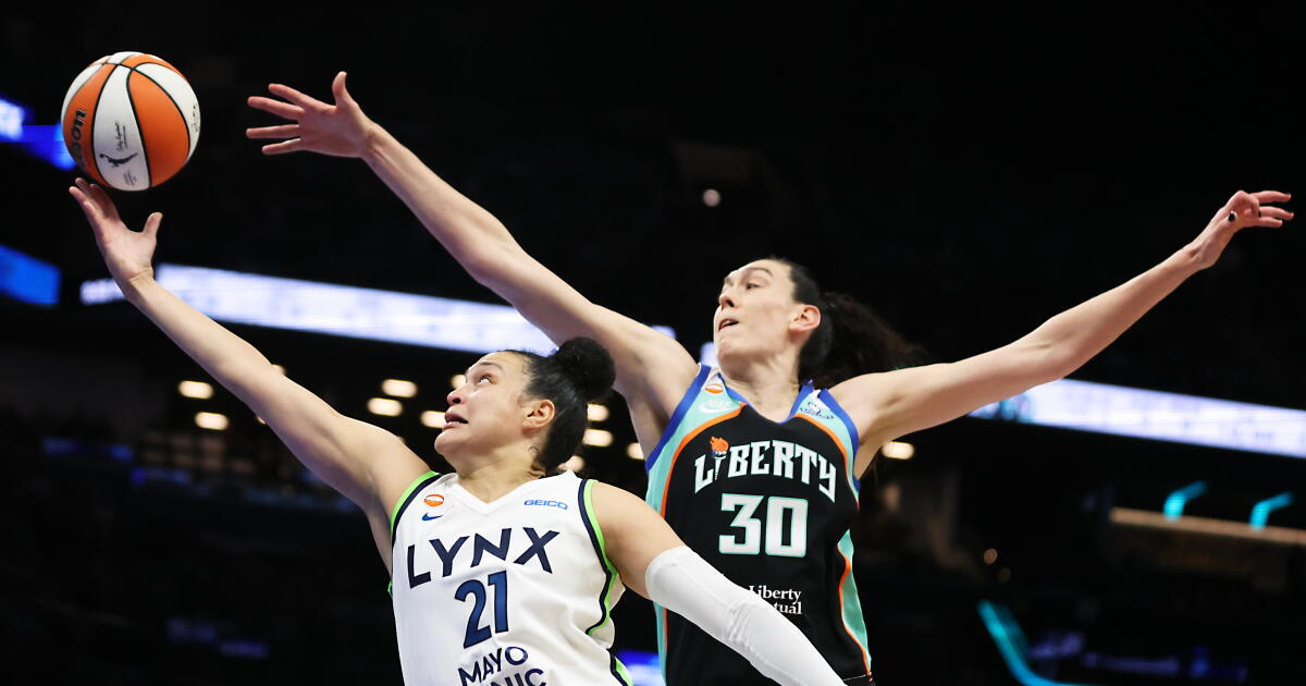 Photo: latimes.com Minnesota guard Kayla McBride drives to the basket as New York forward Breanna Stewart reaches to try to block her shot