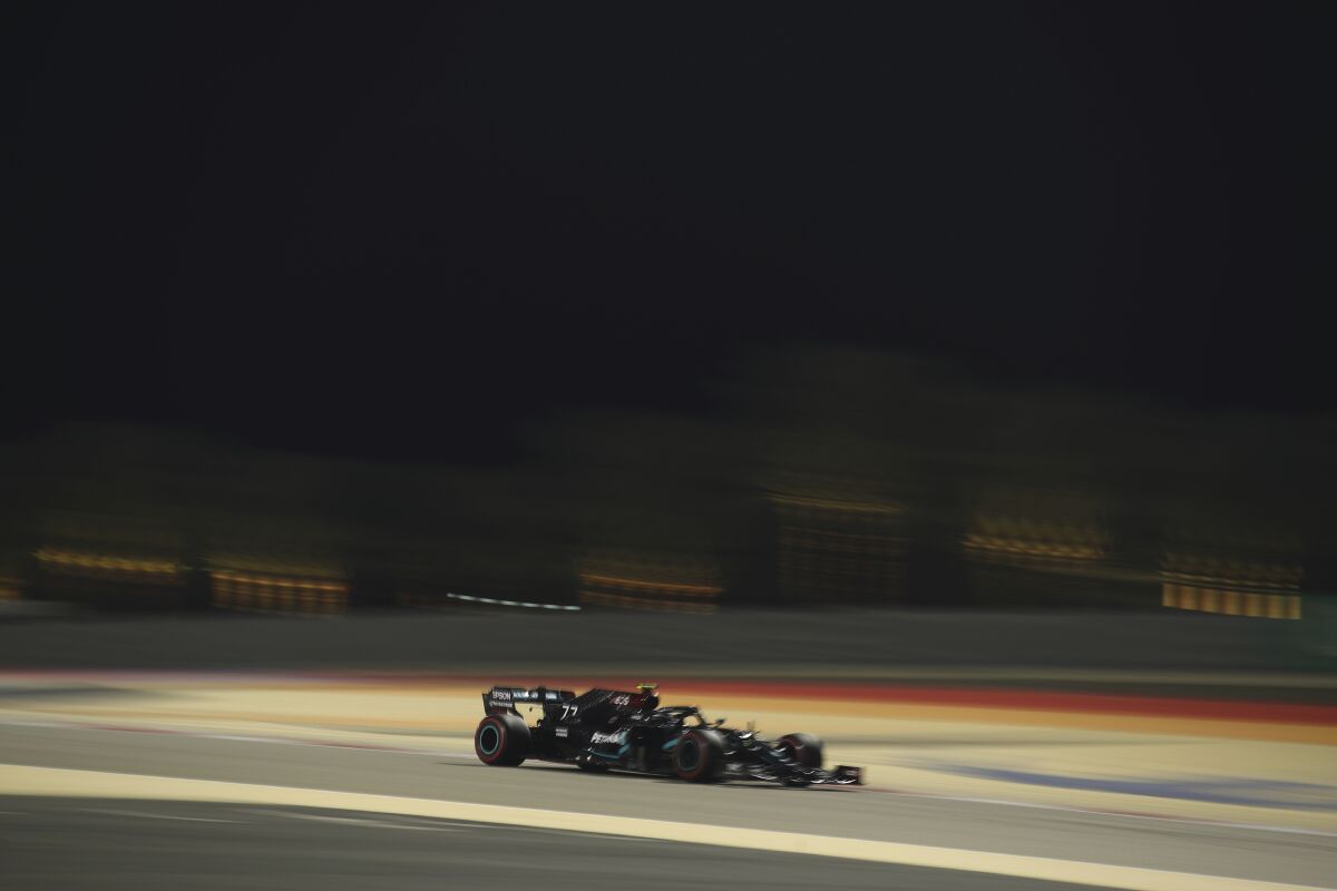 Mercedes driver Valtteri Bottas of Finland steers his car during the third free practice at the Formula One Bahrain International Circuit in Sakhir, Bahrain, Saturday, Dec. 5, 2020. The Bahrain Formula One Grand Prix will take place on Sunday. (Brynn Lennon, Pool via AP)