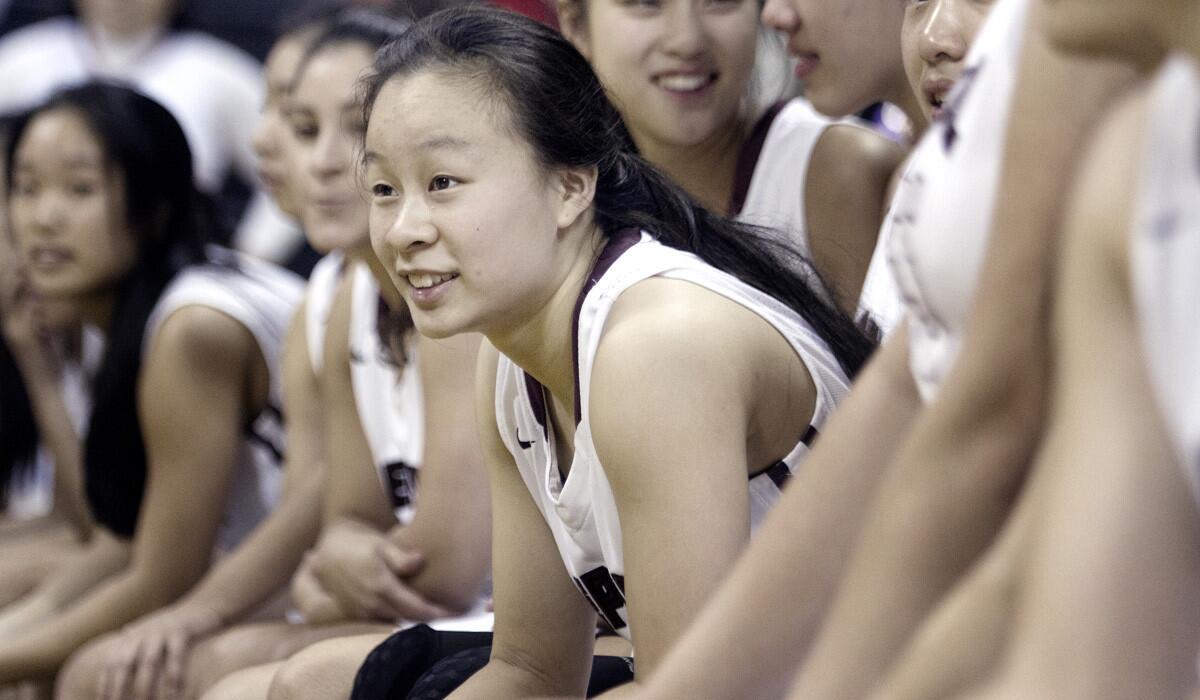 Mark Keppel High School's Lauren Saiki sits with her teammates after winning a game against Redondo Union at Cal State Long Beach on March 21. Mark Keppel won against Redondo Union 48-44 and their first CIF title ever. Saiki will be playing for Division 1 West Virginia University.