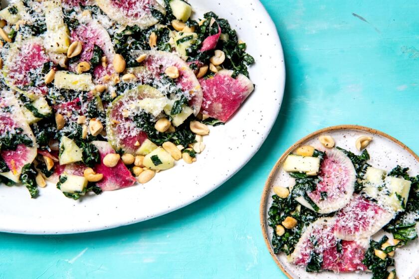 Watermelon radish rounds add brilliant color to this salad, but any radishes work.