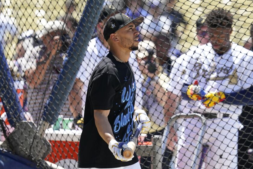 National League outfielder Mookie Betts, of the Los Angeles Dodgers, works out during batting practice prior to the MLB All-Star baseball game, Tuesday, July 19, 2022, in Los Angeles. (AP Photo/Abbie Parr)