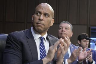 Sen. Cory Booker, D-N.J., left, and Sen. Alex Padilla, D-Calif., right, are seen during a Senate Judiciary Committee business meeting, Thursday, Feb. 16, 2023, on Capitol Hill in Washington. (AP Photo/Mariam Zuhaib)