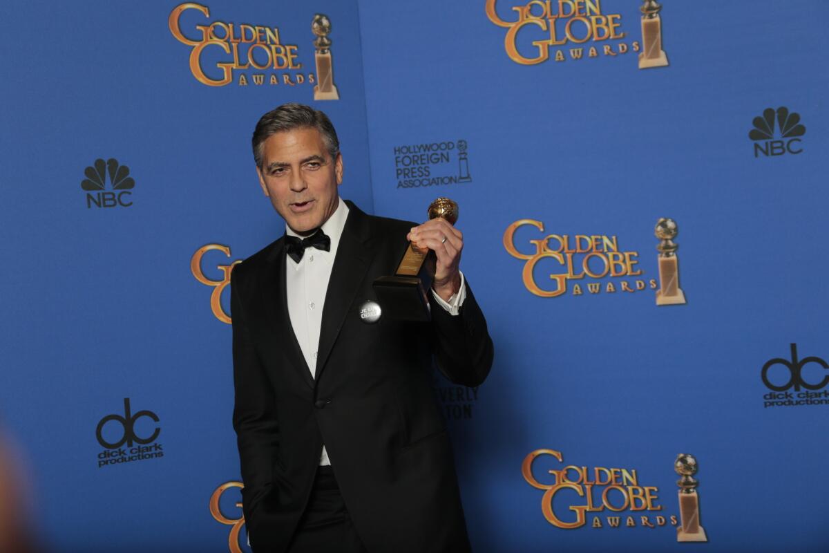 George Clooney with his Golden Globe at the 72nd Annual Golden Globe Awards show at the Beverly Hilton Hotel in January.