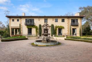 Built in 1929 by Wallace Neff, the Italian Revival-style residence features hand-painted ceilings, antique chandeliers and marble floors.