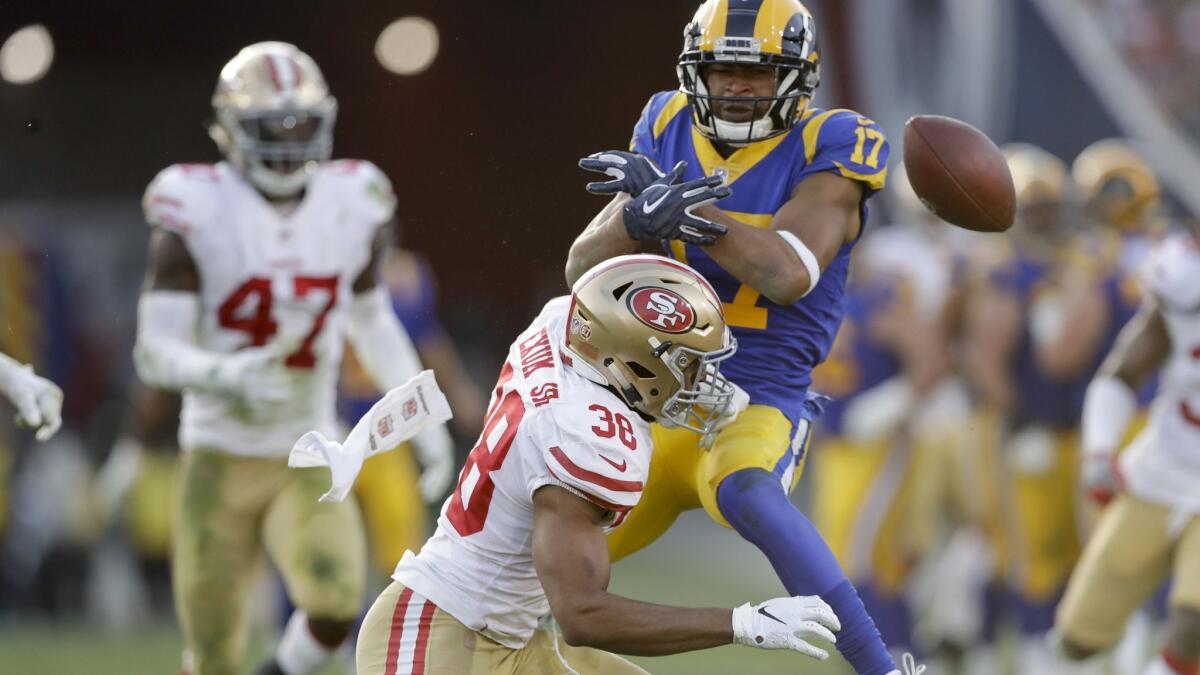 49ers safety Antone Exum Jr. breaks up a pass intended for Rams wide receiver Robert Woods during the second half of a game Dec. 30.