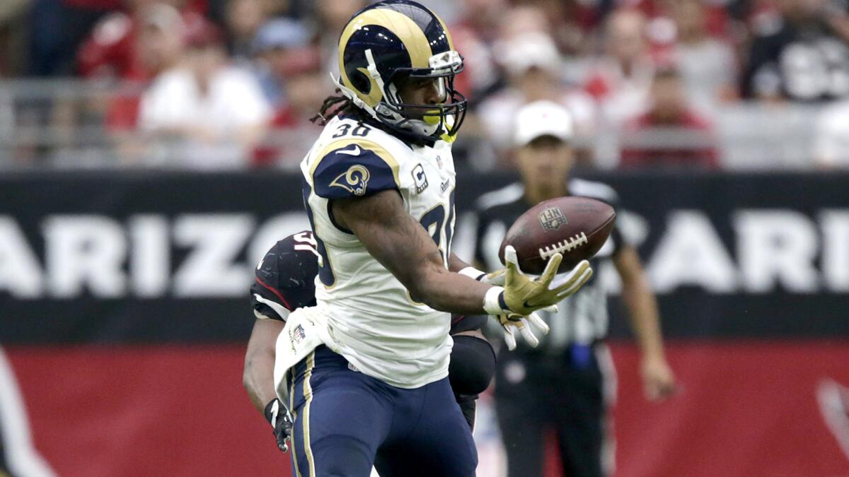 Rams running back Todd Gurley, making a one-handed catch against the Cardinals last weekend, has rushed for only 216 yards this season.