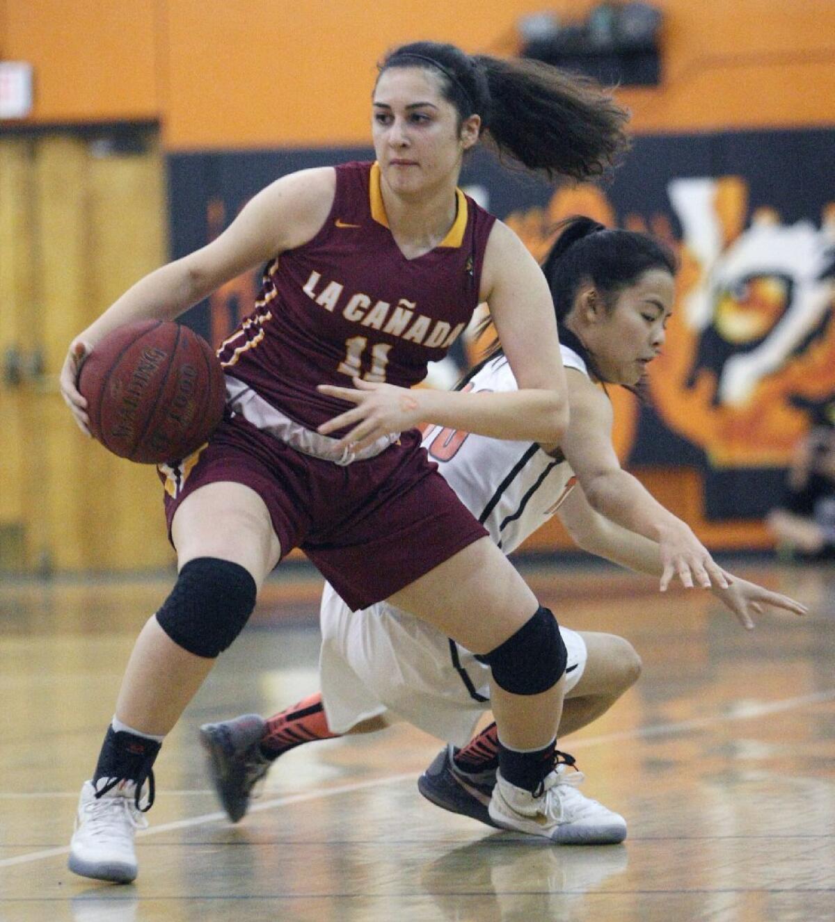 La Cañada High's Kristina Kurdoghlian and the Spartans clinched at least a share of the Rio Hondo League title with Friday's win.