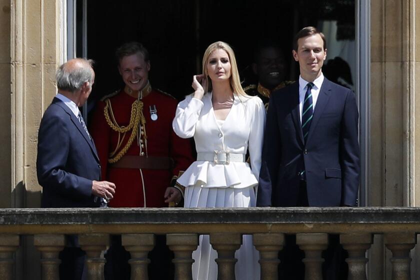 Jared Kushner, right, and Ivanka Trump, second right, watch from a window before a ceremonial welcome in the garden of Buckingham Palace in London for President Donald Trump and first lady Melania Trump, Monday, June 3, 2019 on the opening day of a three day state visit to Britain. (AP Photo/Frank Augstein)