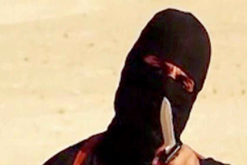 A masked militant is shown in a screengrab from a video released by Islamic State. The FBI believes it has identified the man who killed U.S. journalists James Foley and Steven Sotloff.