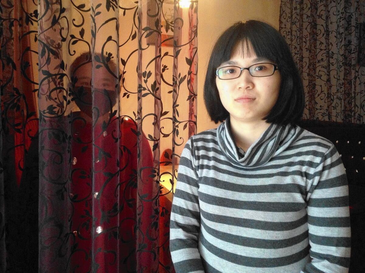 Cao Ju, left, and her attorney, Huang Yizhi, won China's first gender employment discrimination lawsuit.