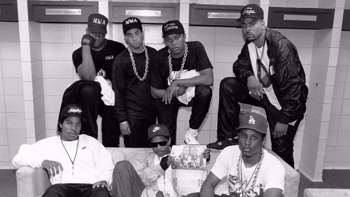 N.W.A pose with rappers the D.O.C. and Laylaw from Above the Law (From left, standing: Laylaw, DJ Yella, Dr. Dre and the D.O.C. seated Ice Cube, Eazy-E and MC Ren) backstage at the Kemper Arena during their "Straight Outta Compton" tour in June 1989 in Kansas City.