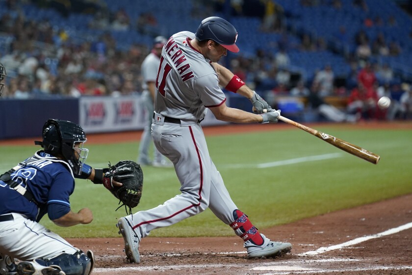 Washington Nationals' Ryan Zimmerman (11) connects for a two-run home run off Tampa Bay Rays relief pitcher Jeffrey Springs during the fifth inning of a baseball game Wednesday, June 9, 2021, in St. Petersburg, Fla. (AP Photo/Chris O'Meara)