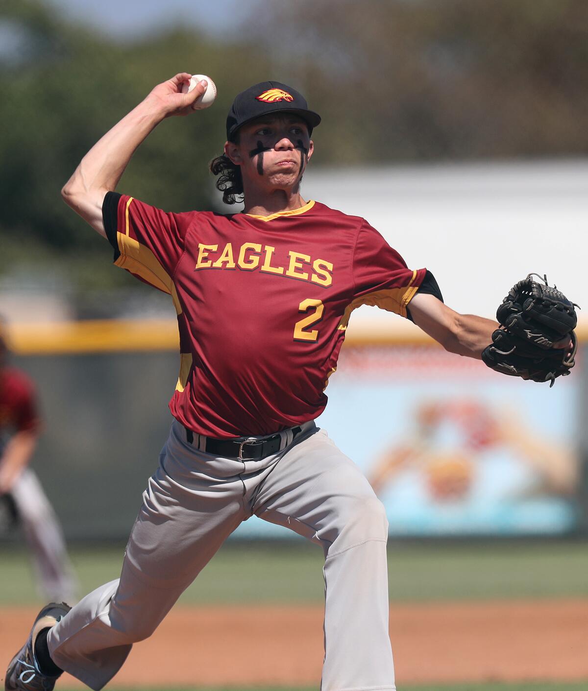 Estancia starter Andrew Mits pitches against Costa Mesa during the first inning in a Battle for the Bell game on April 13.