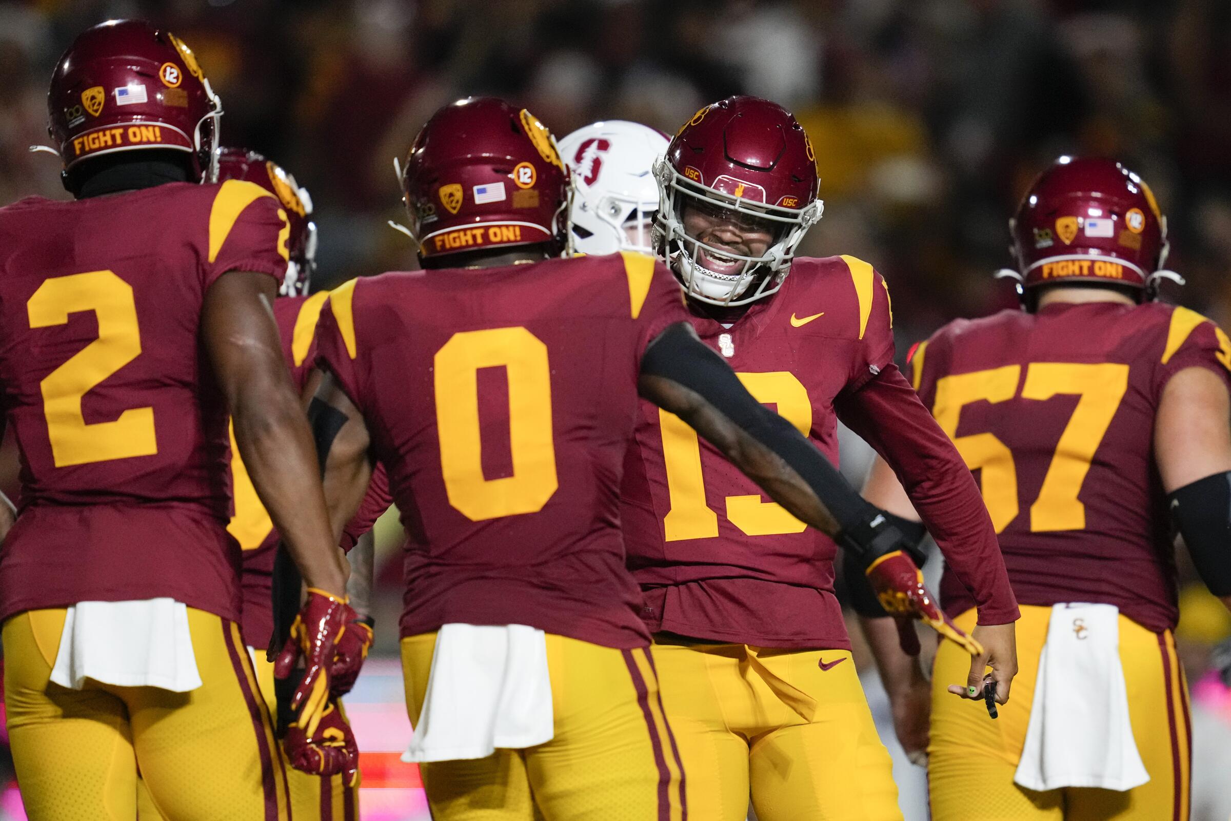 USC running back MarShawn Lloyd celebrates with quarterback Caleb Williams after scoring a touchdown.