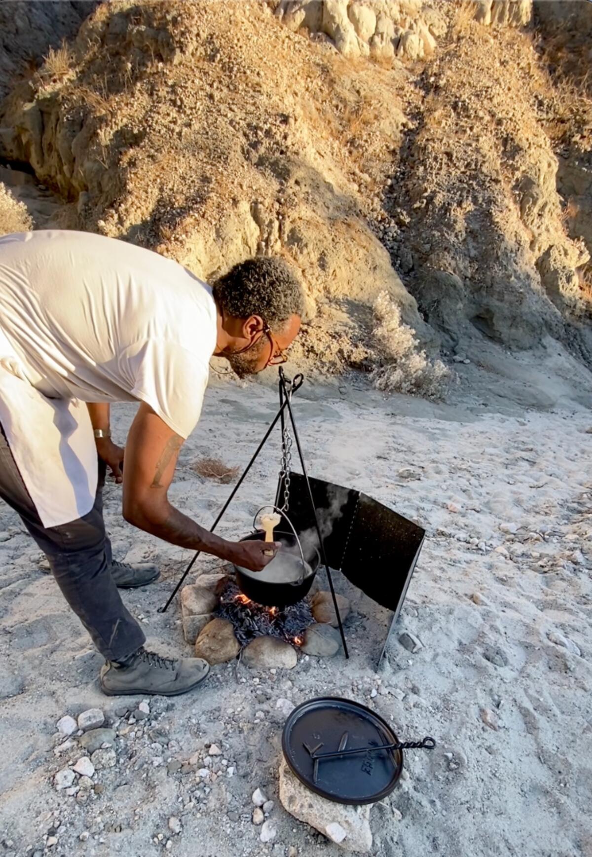 Barrett cooking rice in the canyons south of Joshua Tree.