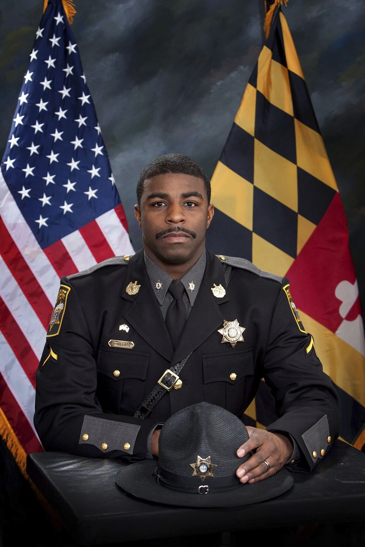 This photo provided by the Wicomico County Sheriff's Office shows Deputy First Class Glenn Hilliard. The Maryland deputy was shot and killed while trying to arrest a fugitive, authorities said. Hilliard spotted the suspect, who was wanted on multiple felony warrants, coming out of an apartment complex Sunday, June 12, 2022 in Pittsville, Maryland, the sheriff's office said. A foot chase ensued and Hilliard was shot trying to arrest the suspect. (Wicomico County Sheriff's Office via AP)