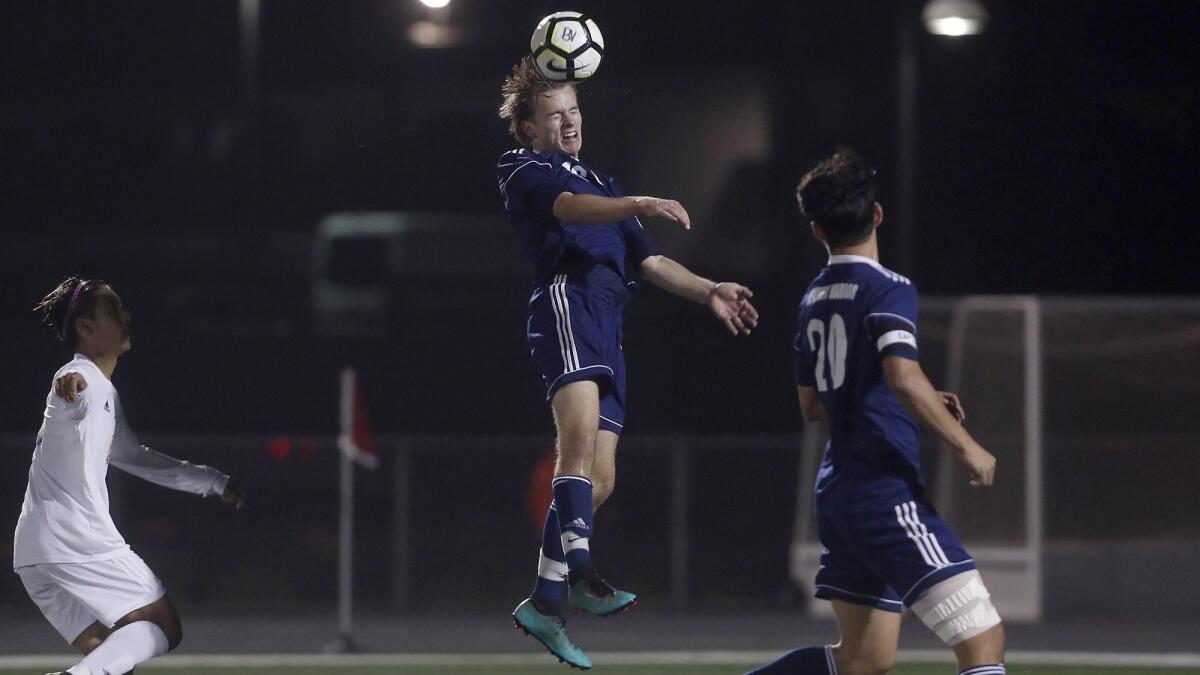 Newport Harbor High's Rory McRory heads the ball against visiting Fountain Valley during the first half of a Sunset Conference crossover match on Wednesday.