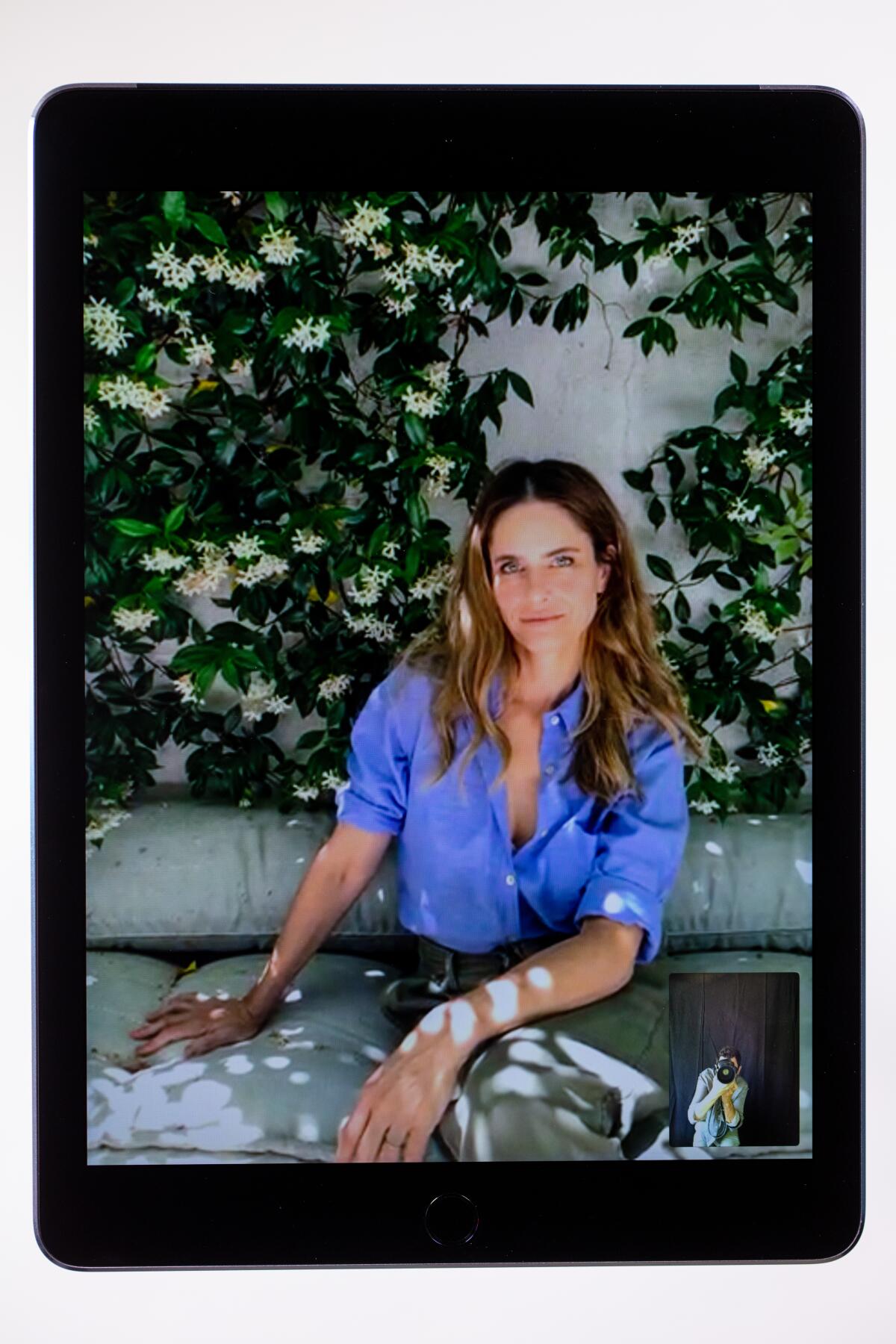 LOS ANGELES, CA - JUNE 11:  Amanda Peet is photographed on an iPad with photographer Jay L. Clendenin from her home. 