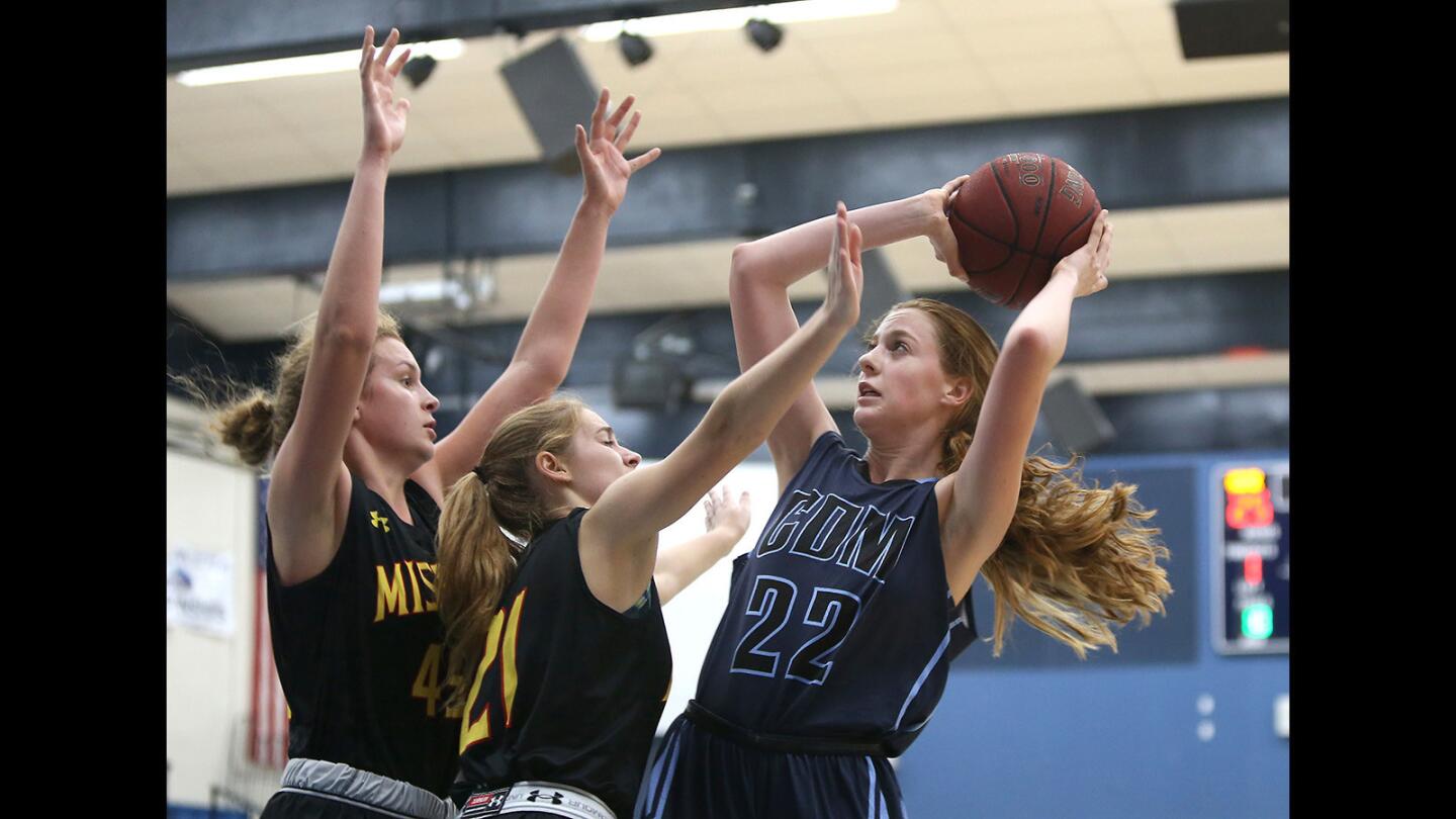 Corona del Mar's Tatiana Bruening pulls back for a jumper against two Mission Viejo defenders during the CdM Tip-Off Tournament on Tuesday.