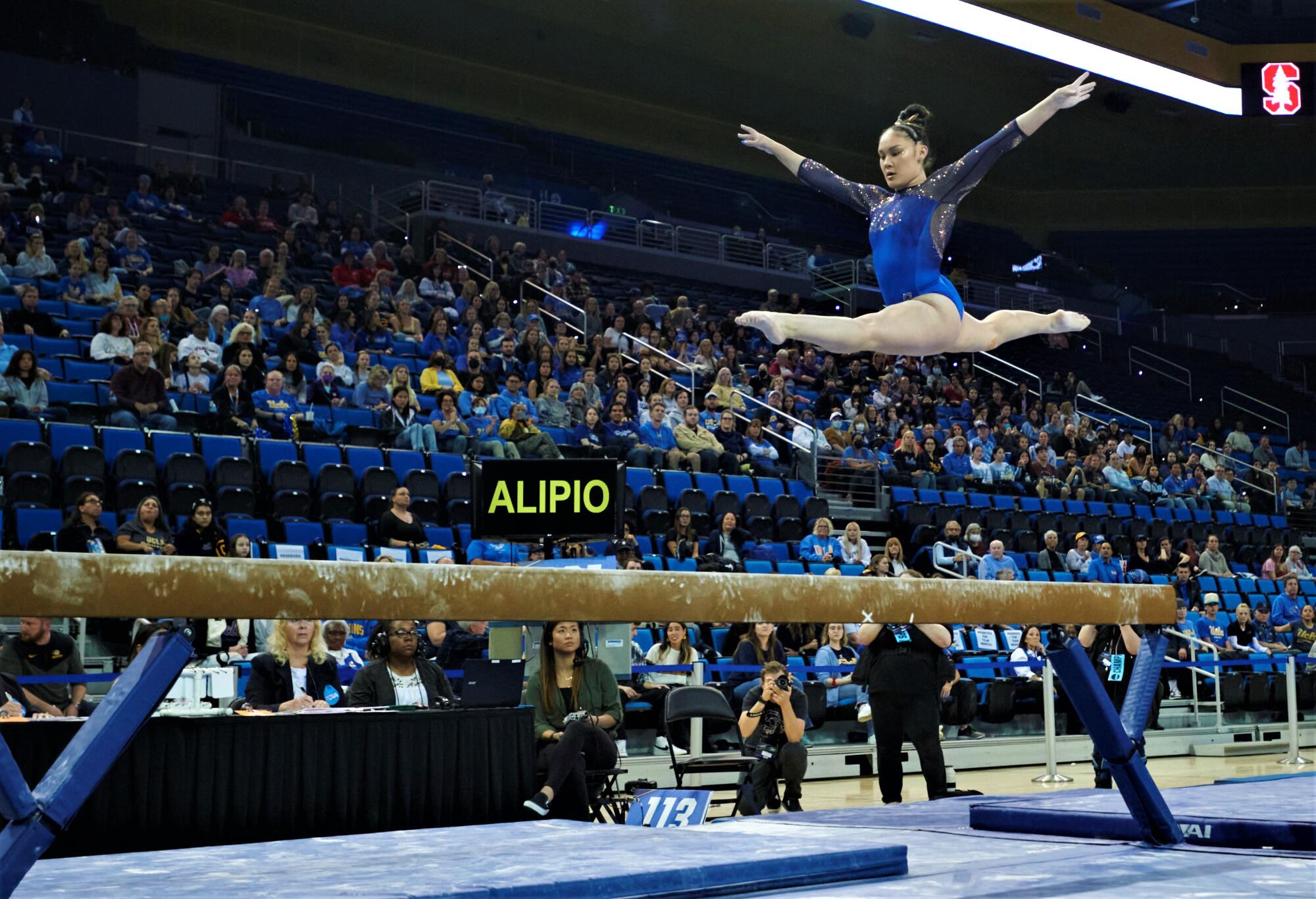 UCLA gymnast Alipio Ciena competes on the balance beam during the NCAA regionals at Pauley Pavilion