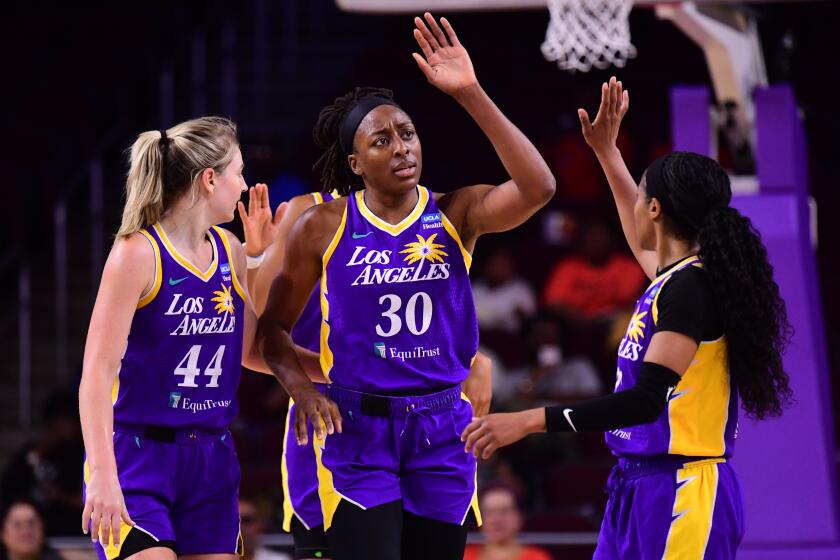 LOS ANGELES, CA - AUGUST 23: Nneka Ogwumike #30 of the Los Angeles Sparks high fives.