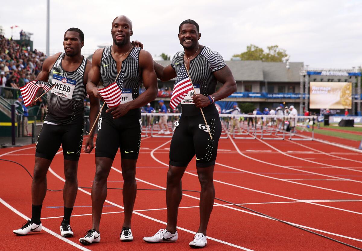 Men's 200 Meter Final winner Justin Gatlin, right, celebrates with third place Ameer Webb, left, and runner-up LaShawn Merritt, center after their race at the U.S. Olympic trials.