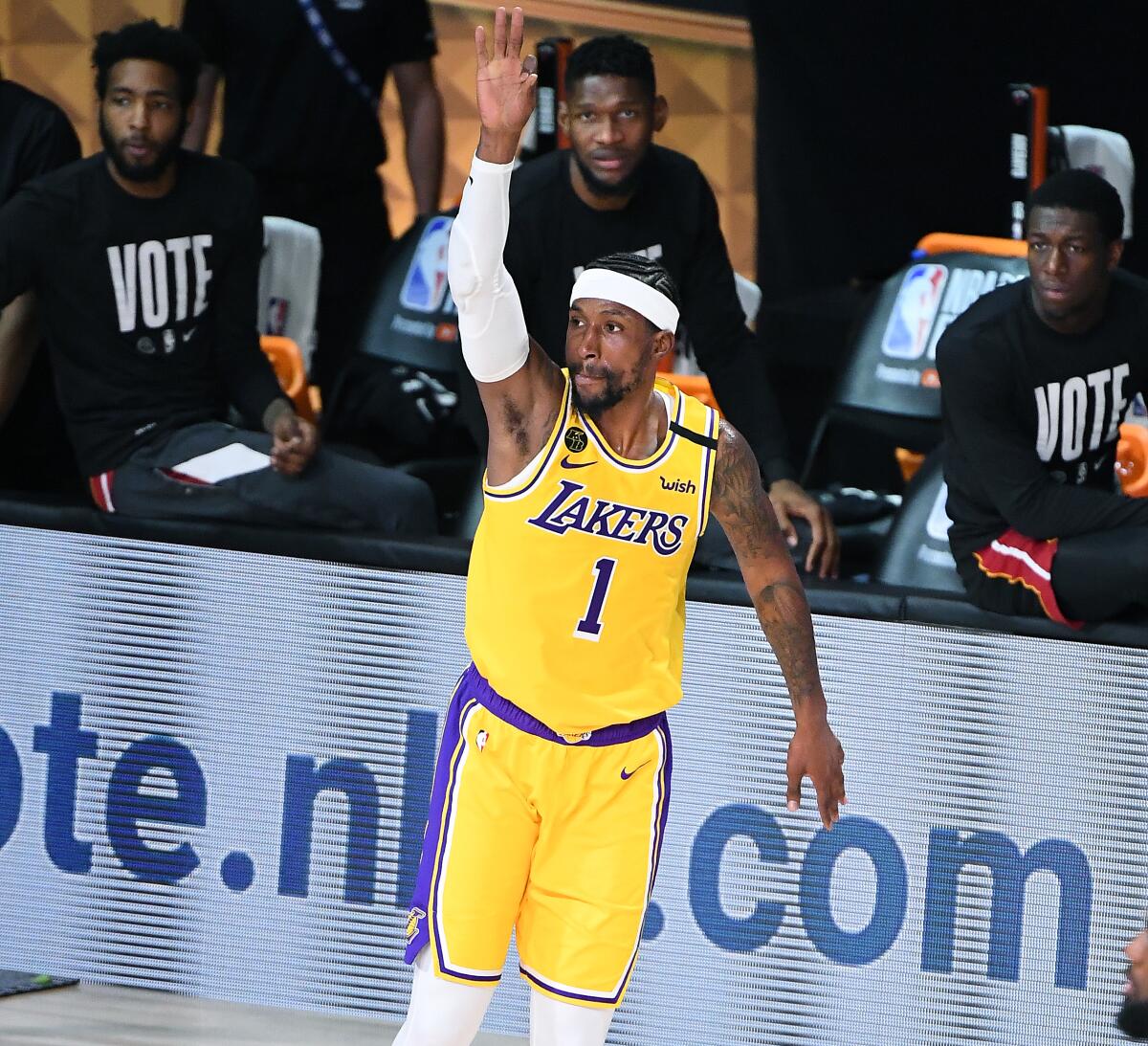 Kentavious Caldwell-Pope raises his arm and jumps as he celebrates on court.