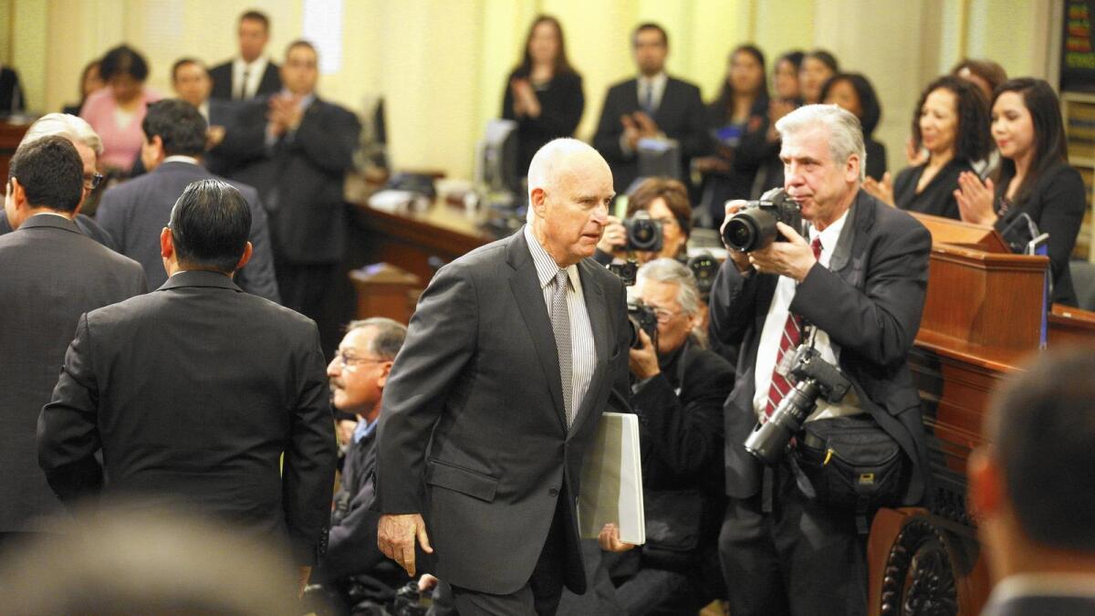 Gov. Jerry Brown, center, is opposed to Proposition 51.