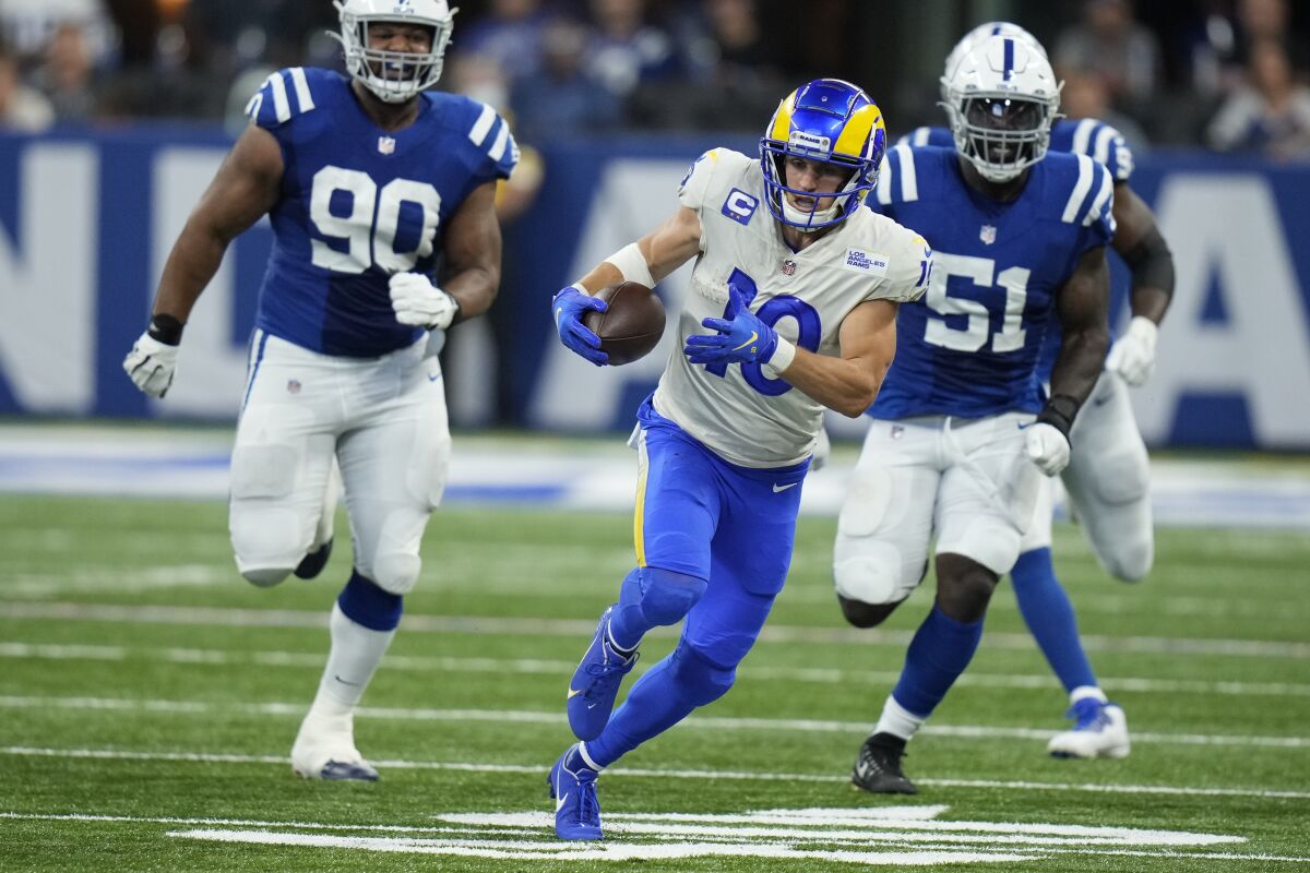  The Rams' Cooper Kupp runs for more yardage after a catch against the Colts.