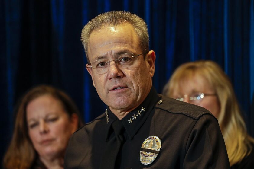 LOS ANGELES, CA - JANUARY 15, 2020 - LAPD Chief Michel Moore, addresses a press conference, flanked by Anne Tremblay, left, Director of Mayor’s Gang Reduction and Youth Development and Eileen M. Decker, President Los Angeles Police Commission, at LAPD Headquarters on January 15, 2020, to discuss 2019 crime statistics of Los Angeles. (Irfan Khan / Los Angeles Times)