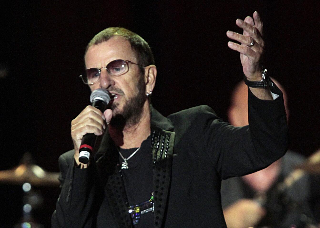 Ringo Starr takes the mike at the El Rey Theatre in Los Angeles on Jan. 20, 2014, during David Lynch's concert salute to Starr for his philanthropic efforts.