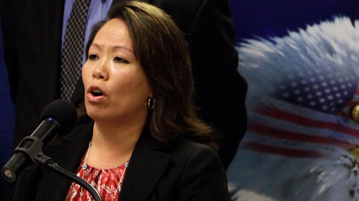 Anna Park, regional attorney at the U.S. Equal Employment Opportunity Commission, speaks at a news conference in 2011. On Wednesday, Park announced a $3.5-million settlement with Irvine customer service firm Alorica Inc.