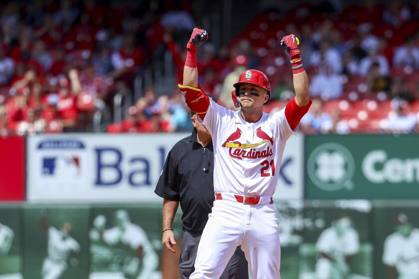 St. Louis Cardinals' Lars Nootbaar gestures toward the dugout after hitting a two-RBI double during the eighth inning of a baseball game against the Arizona DiamondbacksWednesday, April 24, 2024, in St. Louis. (AP Photo/Scott Kane)