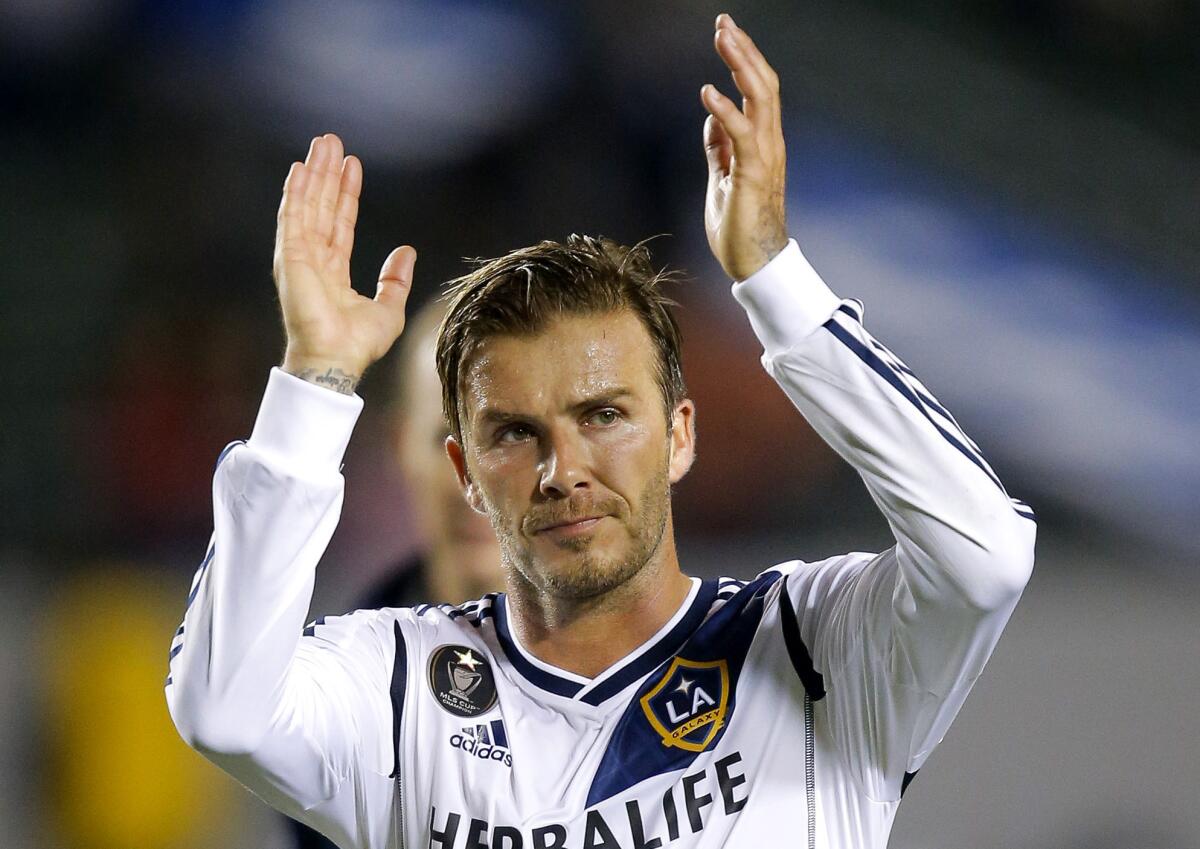 Los Angeles Galaxy's David Beckham acknowledges the fans after a game against the Vancouver Whitecaps last season.