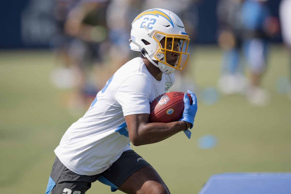 Chargers running back Justin Jackson works on a drill during practice.
