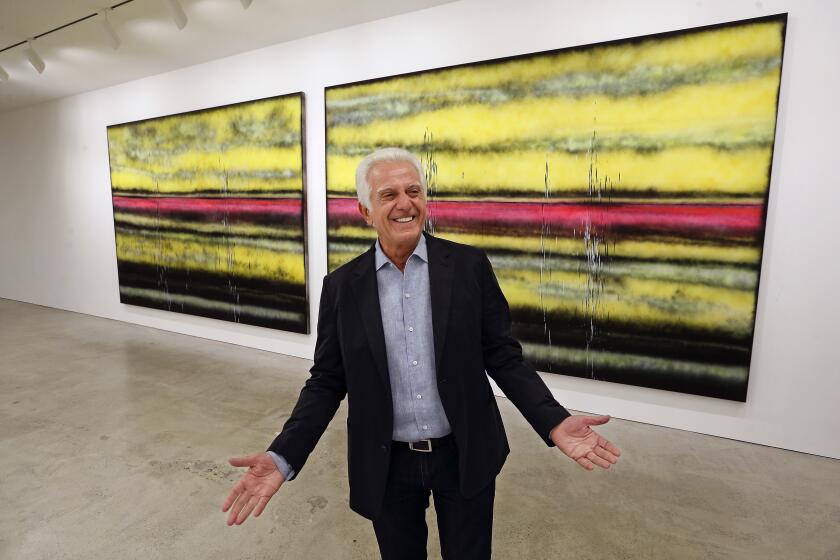 Maurice Marciano, photographed in front of Sterling Ruby's "SP308" during the 2017 installation of the Marciano Art Foundation, which he founded with his brother Paul Marciano. 