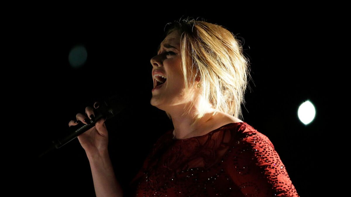 Adele performs at the 2016 Grammy Awards.
