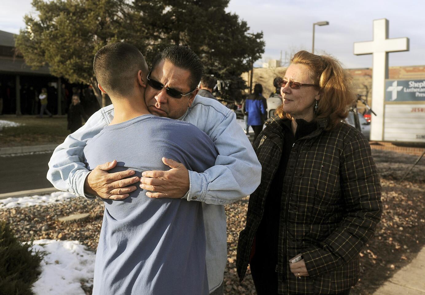 Ruben Allen hugs his son Alex Allen, 17, after a school shooting.