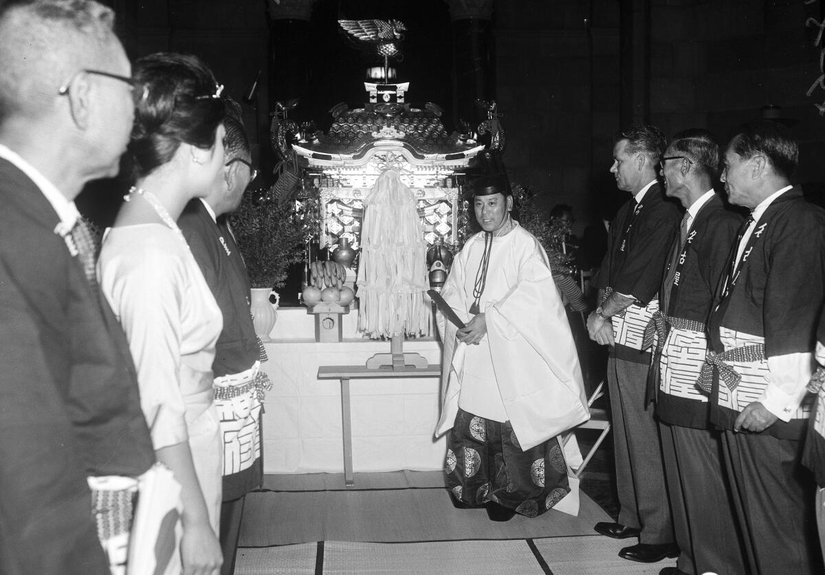 A priest with a shrine. 